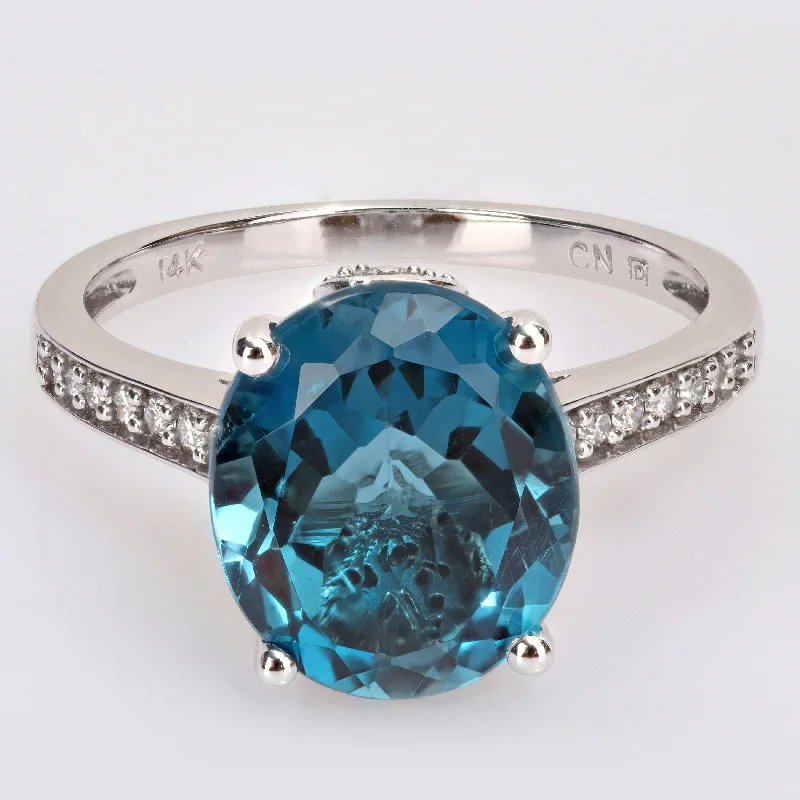 large statement rings -Miadora 14k White Gold Oval-cut London-Blue Topaz and 1/4ct TDW Diamond Cocktail Ring