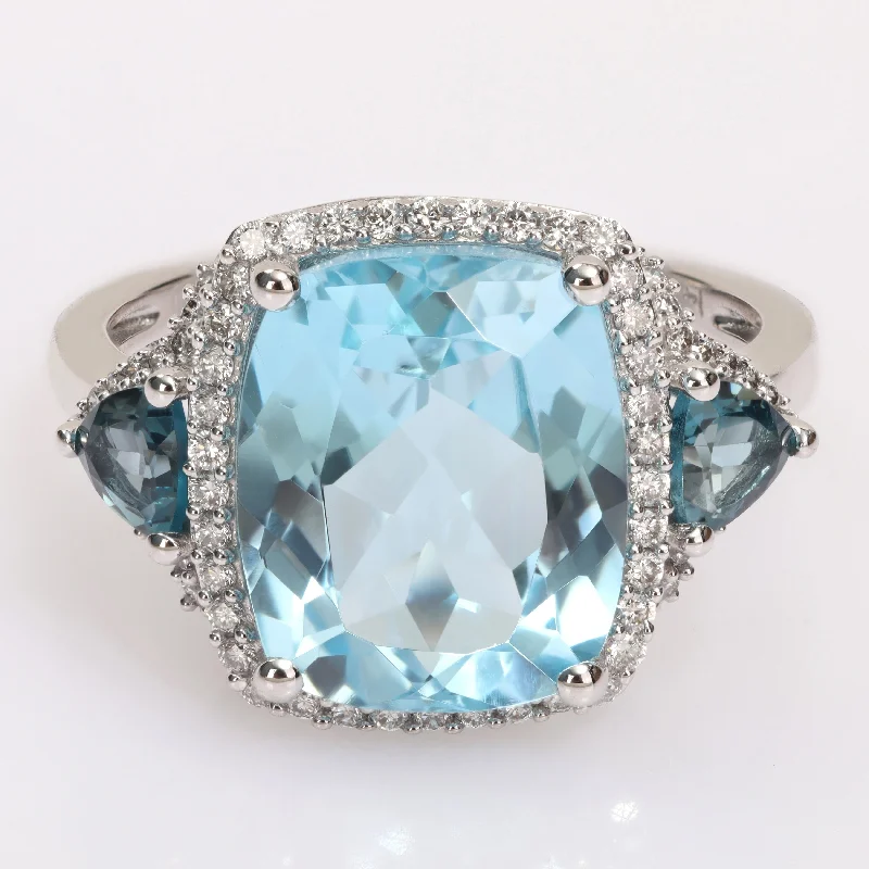 trendy rings for women -Miadora London & Sky Blue Topaz and 1/3ct TDW Diamond 3-Stone Halo Cocktail Ring in 14k White Gold